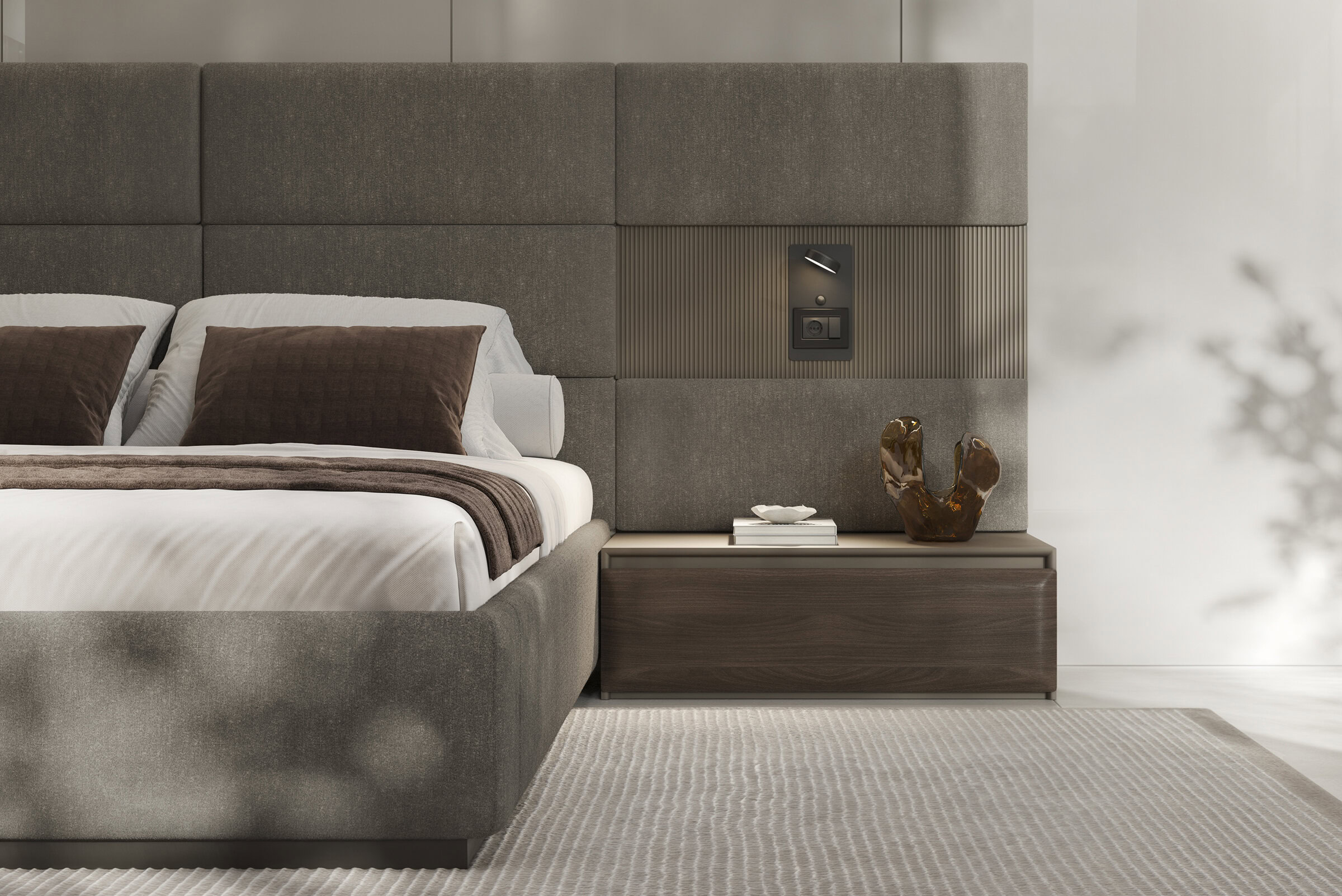 Elegant bedroom furniture featuring a plush upholstered bed and a sleek wooden nightstand, perfect for contemporary interior design.