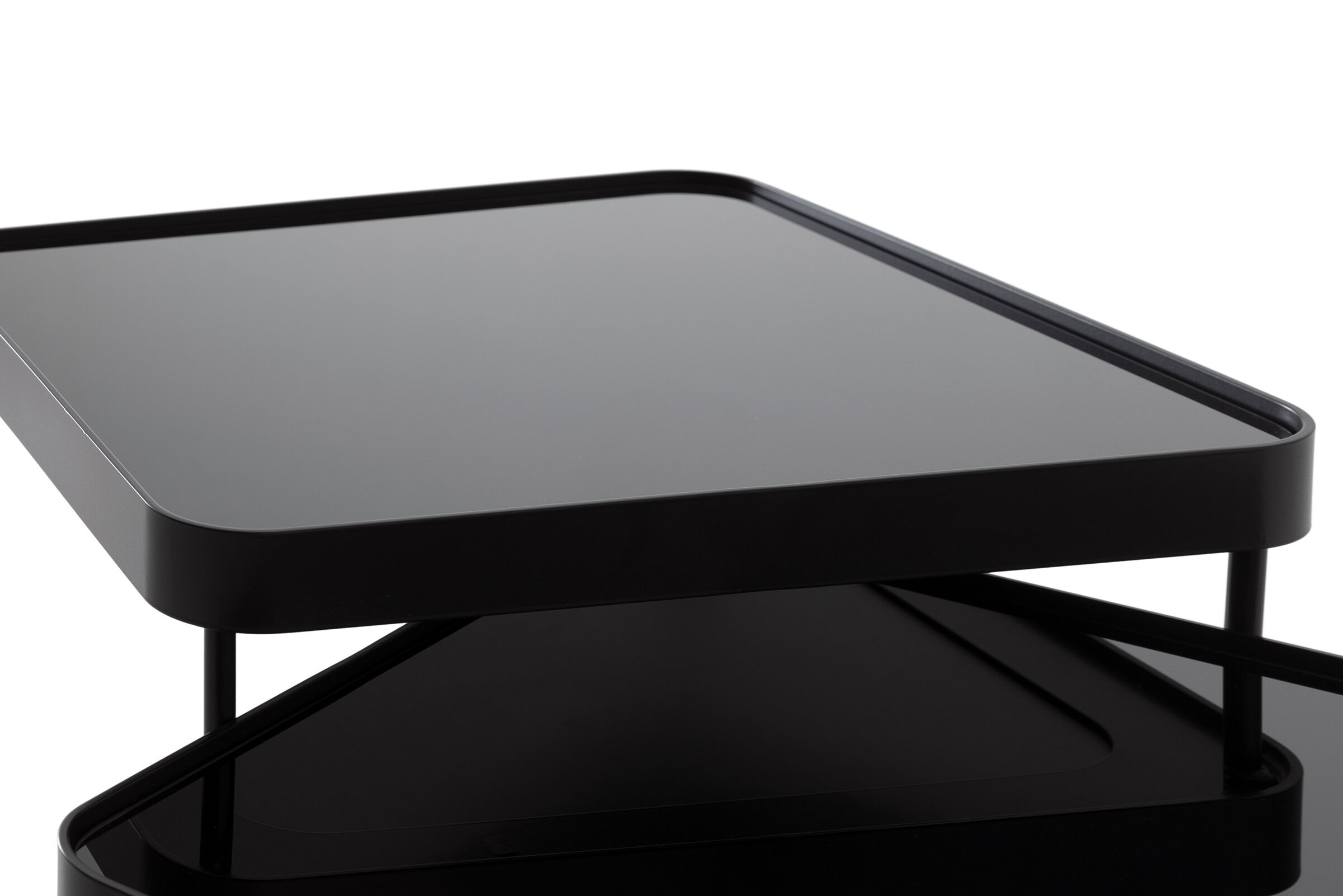 Sleek black modern coffee table with a minimalist design, featuring smooth surfaces and clean lines, perfect for contemporary home decor.