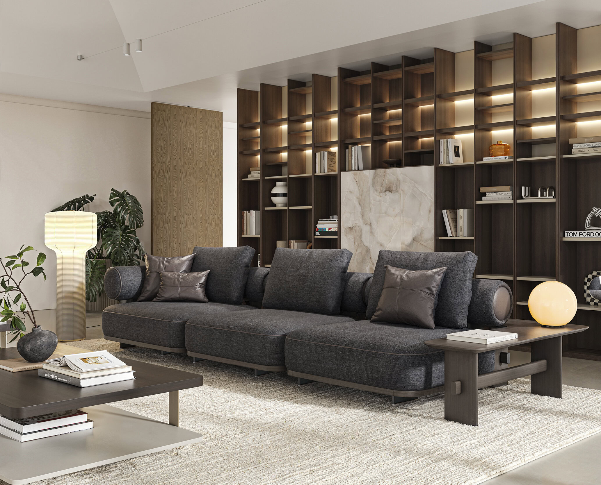 Canapea modulară luxoasă gri închis cu perne într-un decor contemporan de living.