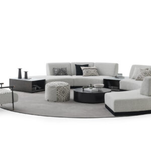 Elegant grey sectional sofa with matching coffee tables and stylish accent chairs, perfect for contemporary living rooms. Crafted for comfort and modern aesthetics.