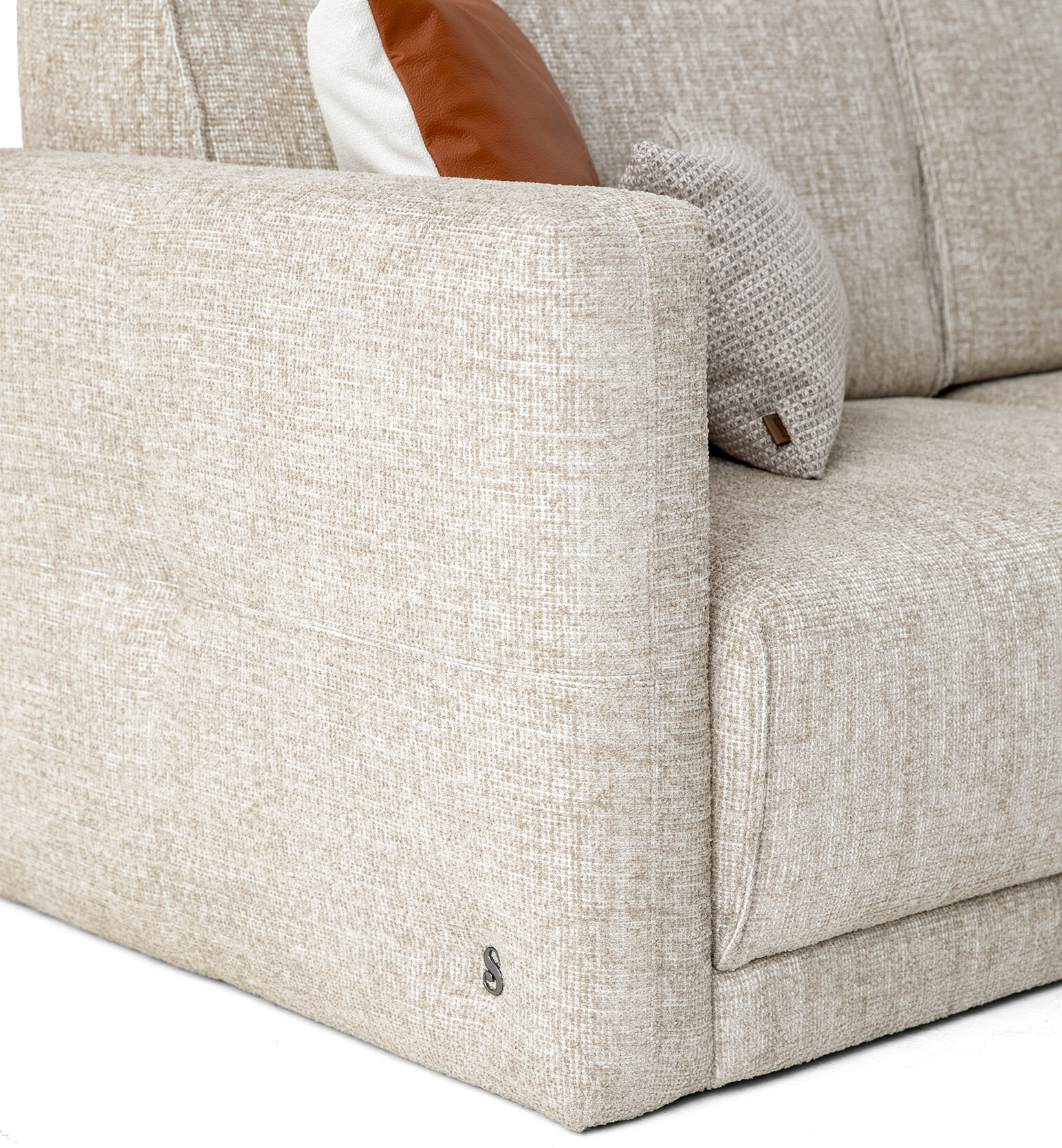Elegant beige fabric sofa with plush cushions, ideal for contemporary living spaces and home comfort.