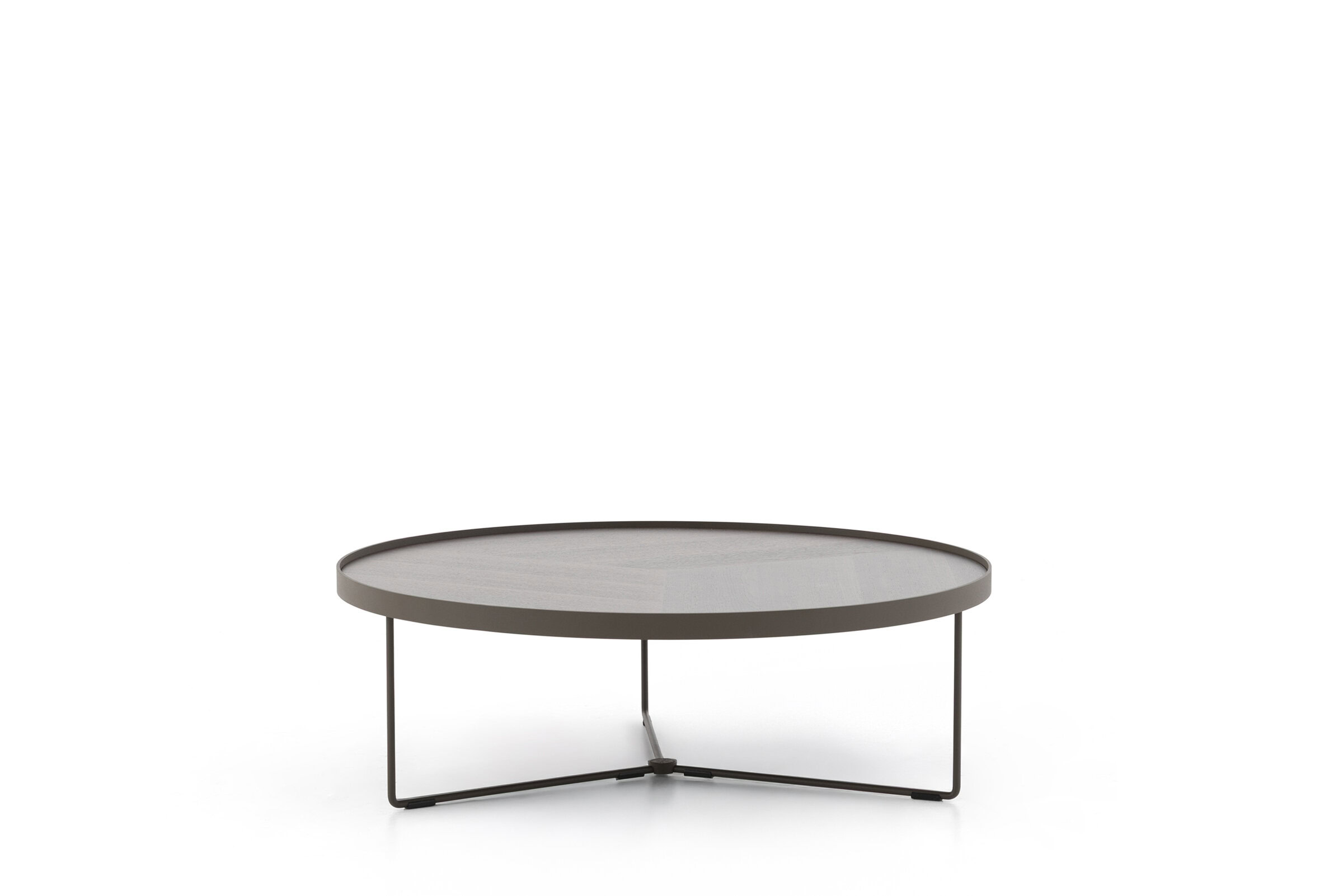 Sleek modern coffee table with a minimalist design featuring metal legs and a smooth, round tabletop, perfect for contemporary living room decor.
