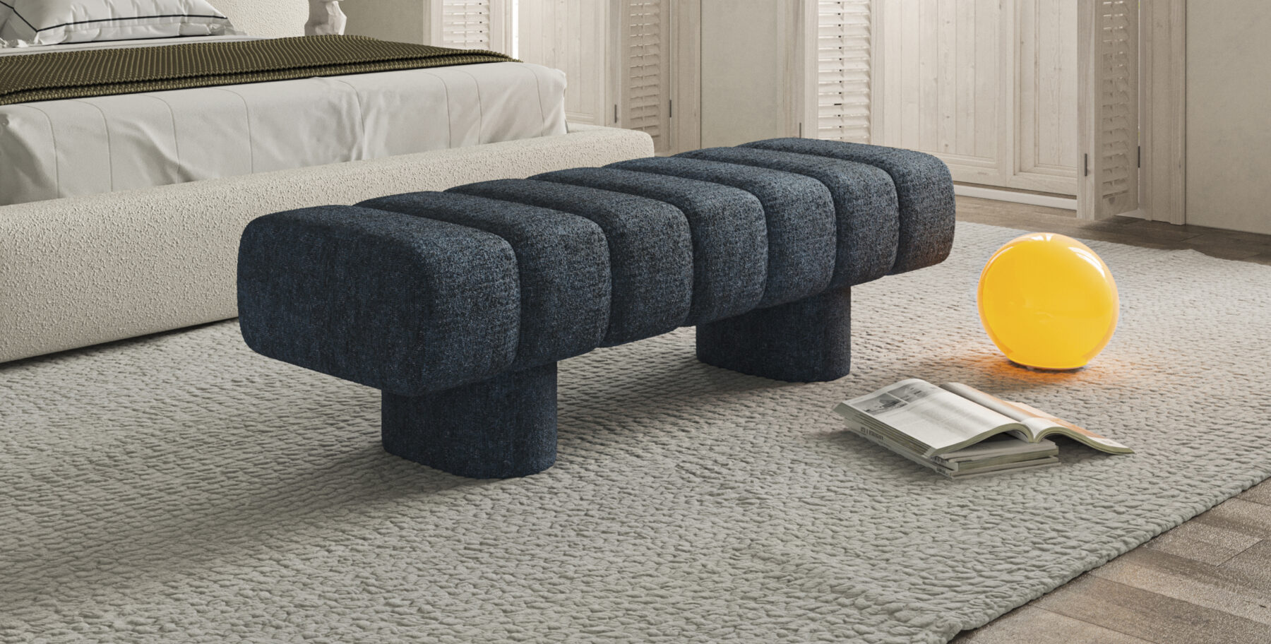 Contemporary blue upholstered bench with rounded design, placed in a cozy living room setting with neutral tones, perfect for modern home decor and stylish interior furniture.