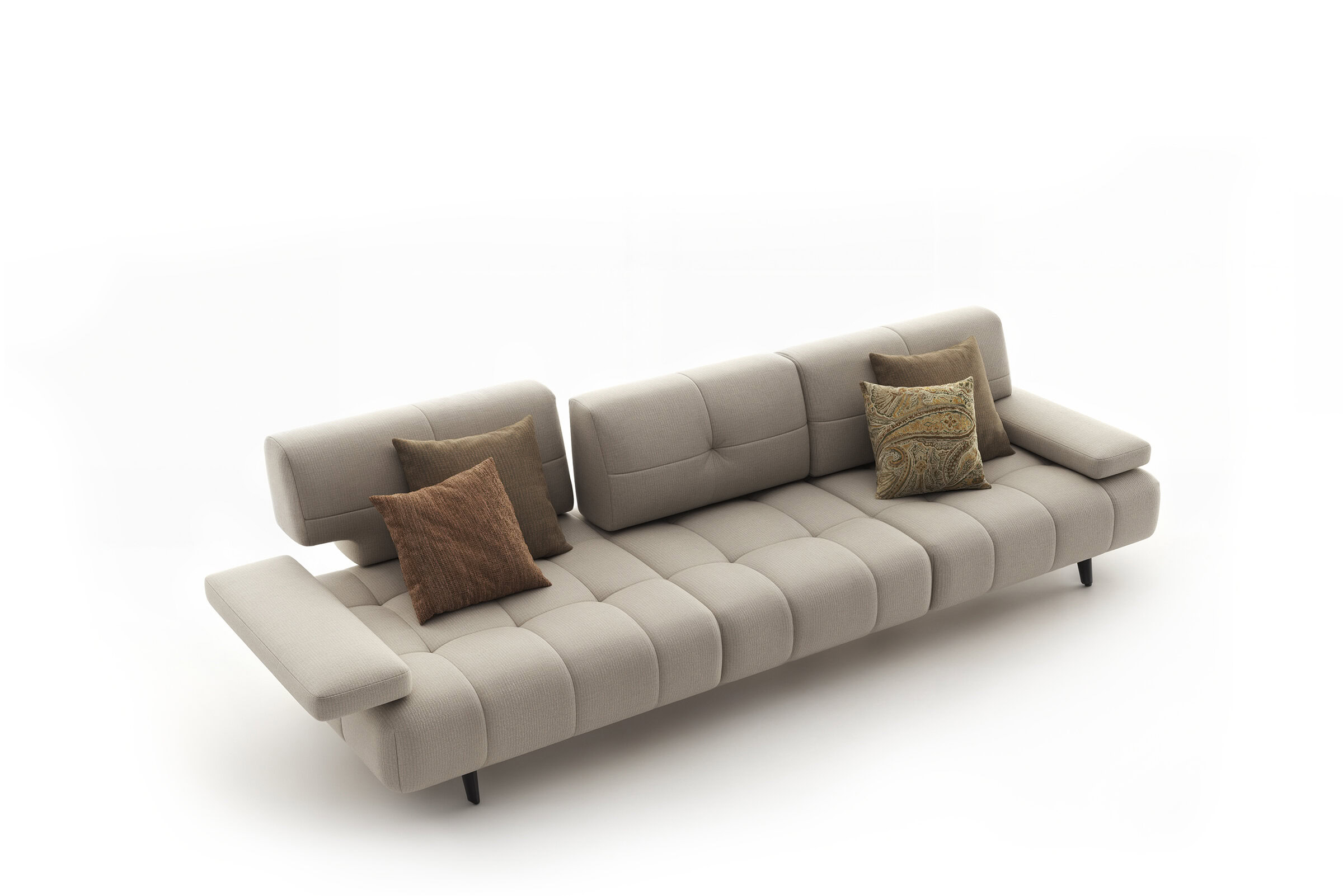 Elegant beige sofa with plush cushions, ideal for contemporary living rooms, showcasing stylish and comfortable furniture from Saloni Furniture.