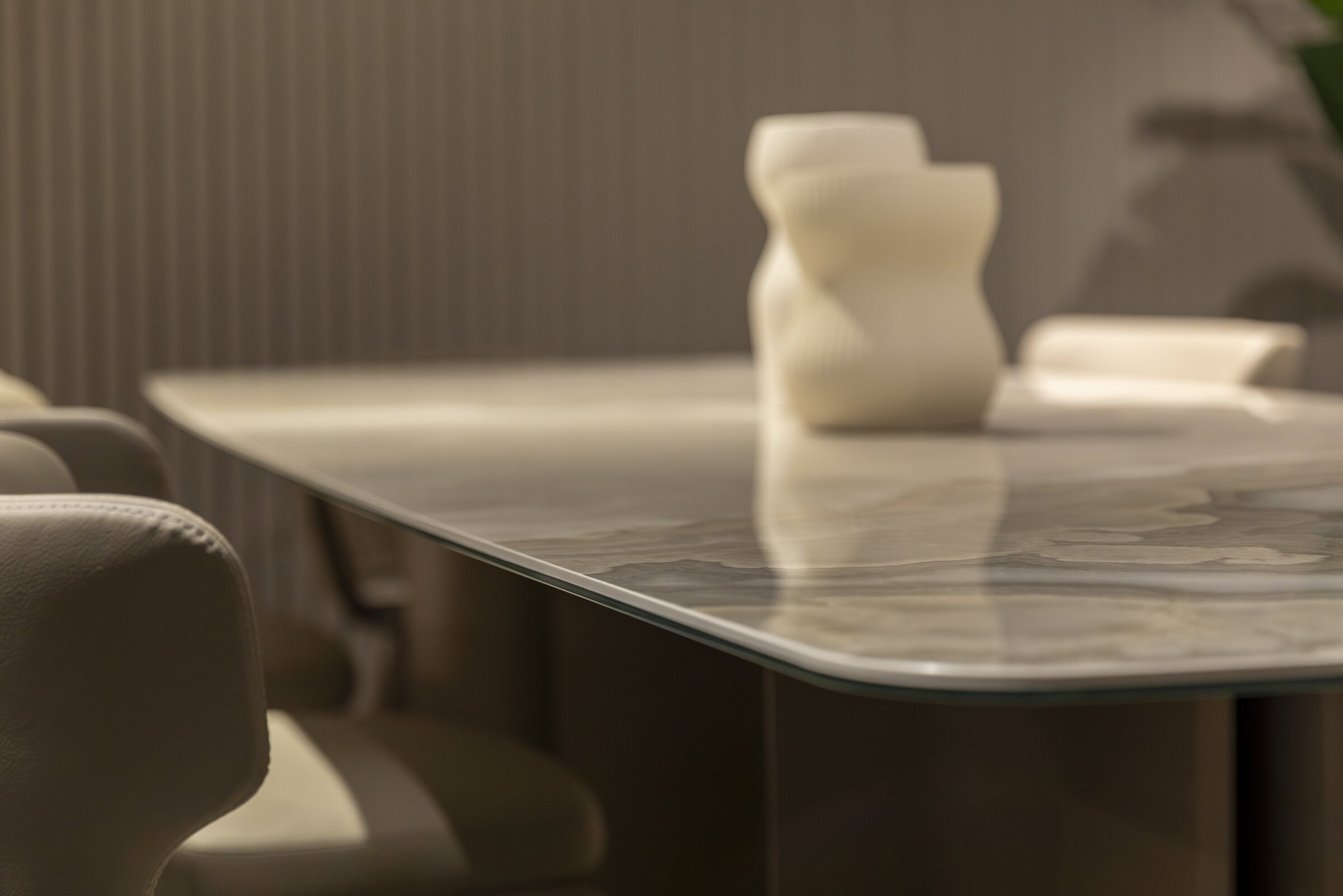 Luxurious modern dining table with a marble top and elegant beige upholstered chairs, perfect for contemporary home décor and stylish gatherings.