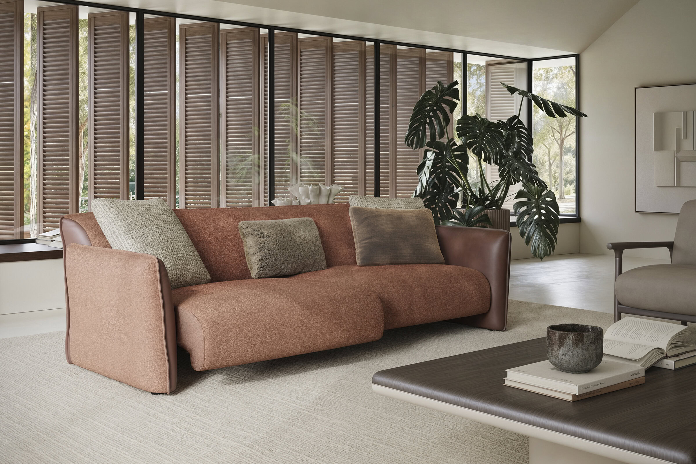 Elegant modern sofa with plush cushions in a contemporary living room setting, featuring natural light and stylish decor.