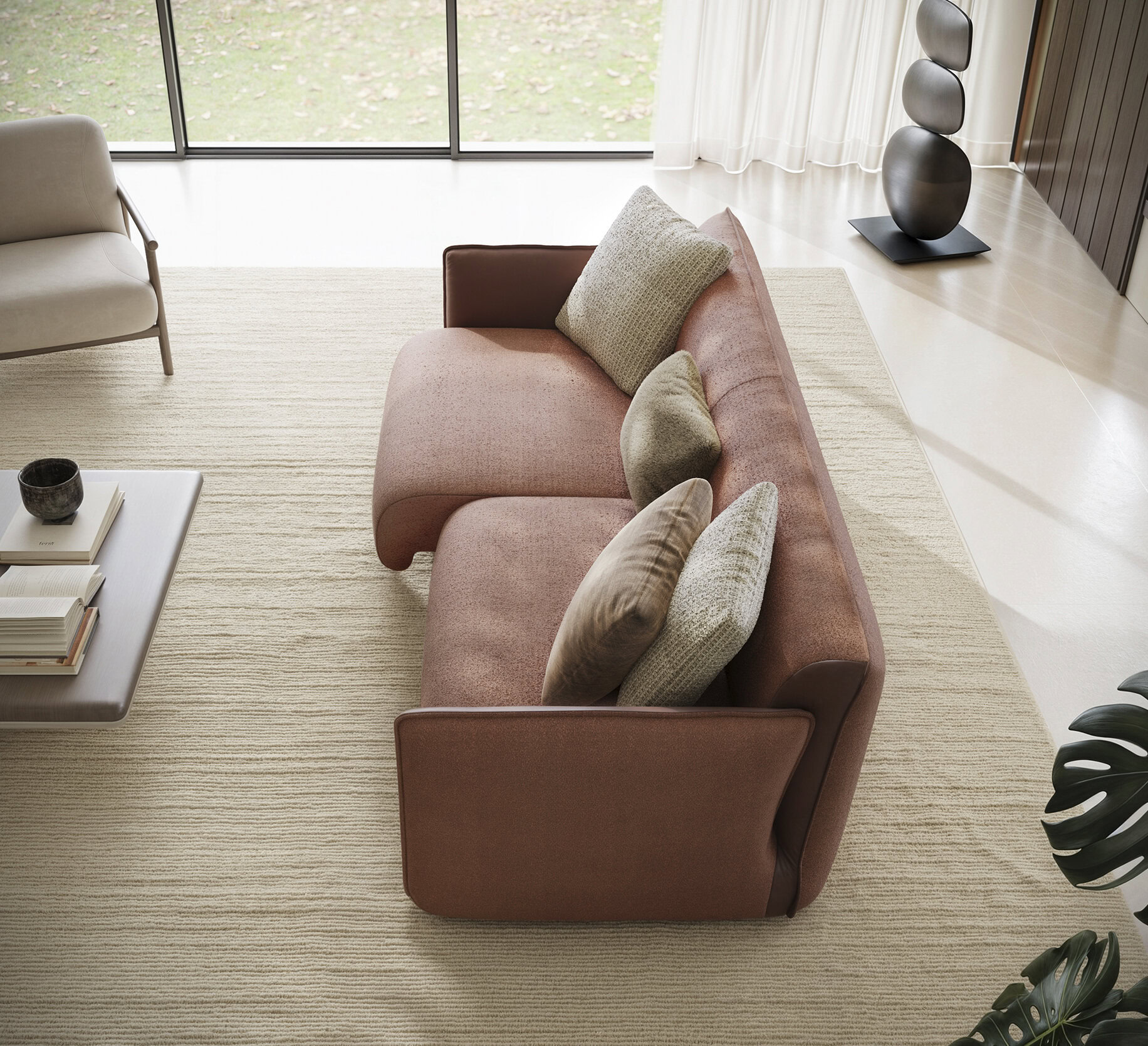 Stylish pink sofa with beige and gray cushions in a contemporary living room with large windows, natural light, and minimalist decor.