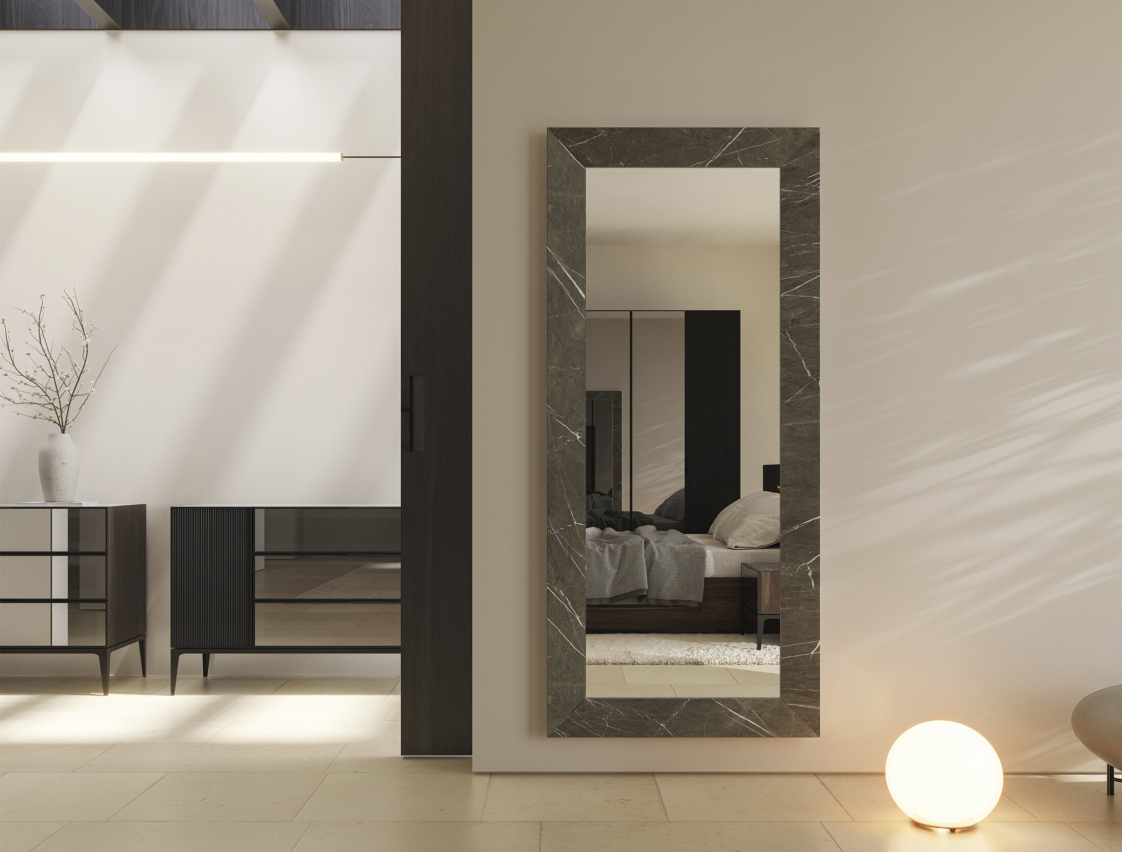 Sleek modern bedroom decor with minimalist furniture and a large framed mirror reflecting a cozy bed, showcasing elegant and contemporary furniture design from Saloni Furniture.